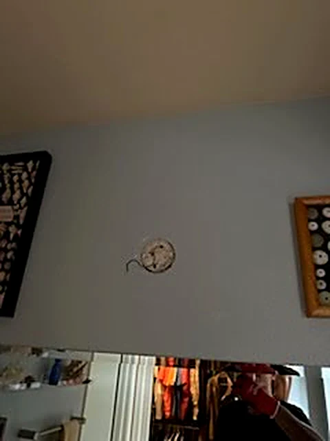 Finished interior wall around a clock